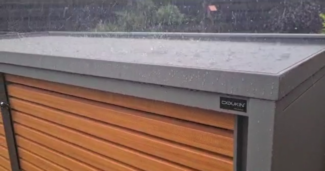 Dukin waste enclosure in the rain The DUKIN waste enclosure perfectly protects waste bins from the weather