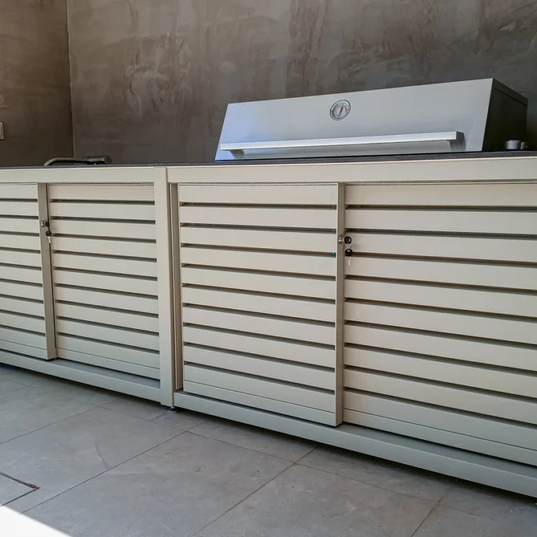 Large bright Dukin outdoor kitchen with built-in grill in countertop